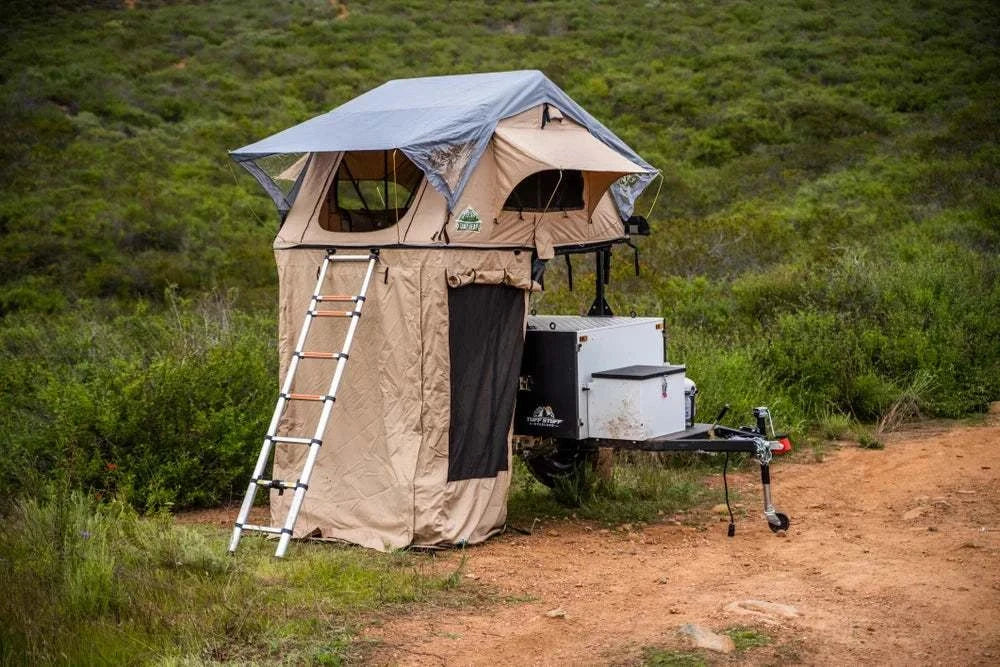 TUFF STUFF® Overland Roof Top Tent Annex Room with floor, set up on rugged terrain, showcasing compatibility with Delta Overland™ and Trailhead™ tents.