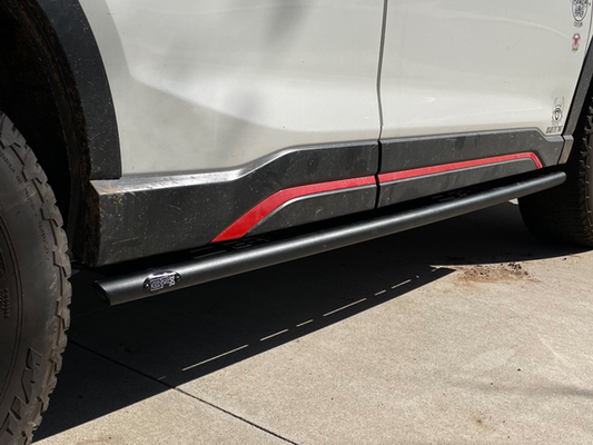 2019-2024 Subaru Forester Revo Step Sliders installed on vehicle, showcasing sturdy design and protection.
