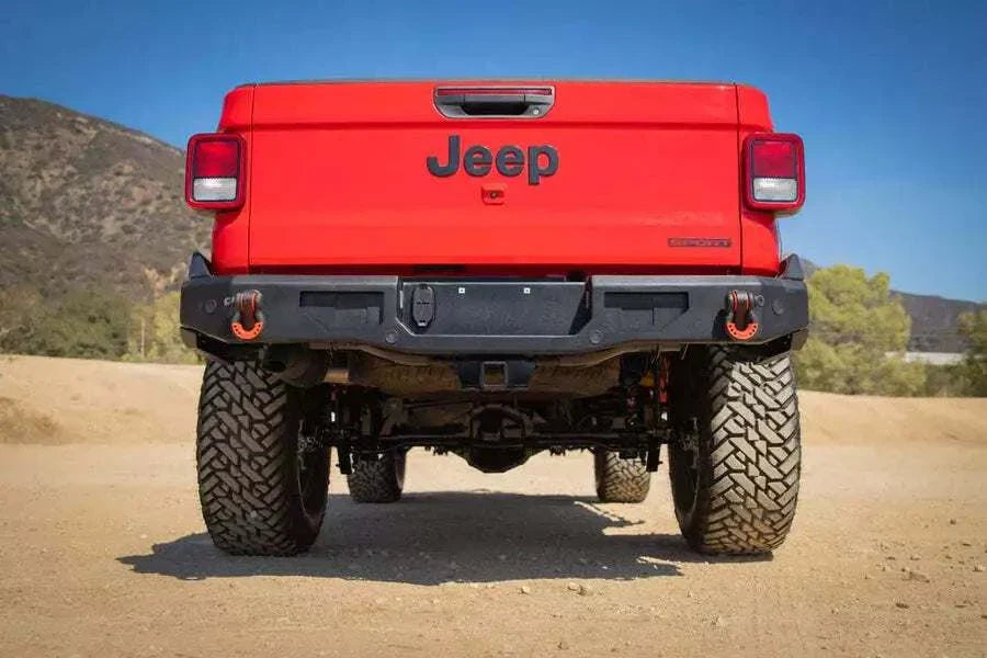 2019-2024 Jeep Gladiator JT with heavy-duty rear bumper displayed outdoors.