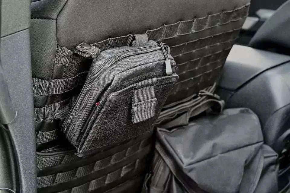 UNIVERSAL MOLLE BAG KIT attached to seat with various gear bags for organization.
