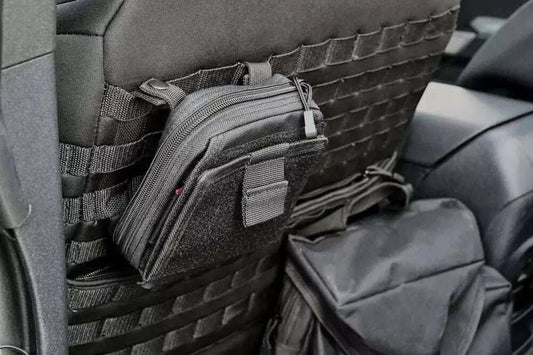 UNIVERSAL MOLLE BAG KIT attached to seat with various gear bags for organization.