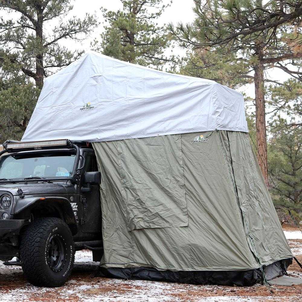 TUFF STUFF® Overland Roof Top Tent with Xtreme Weather Covers in forest setting.