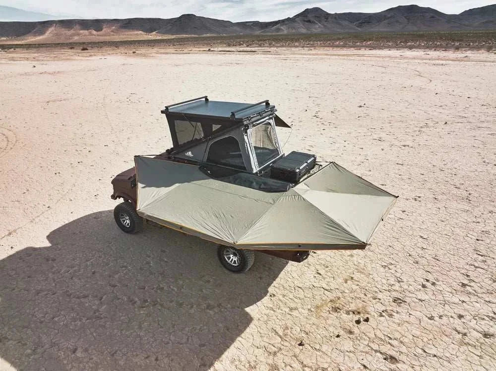 270-degree free-standing awning on a vehicle in a desert landscape.