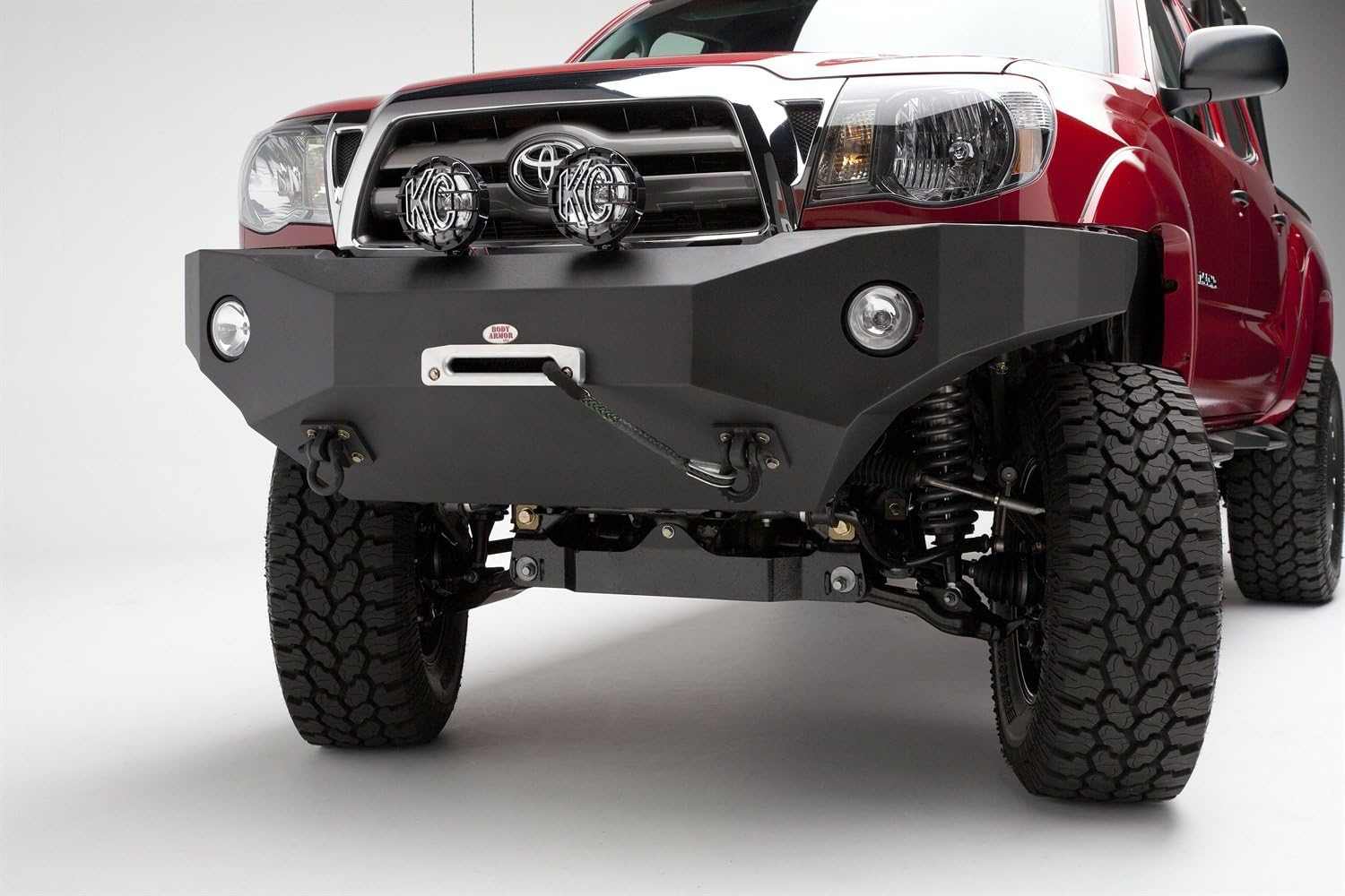 2005-2011 Toyota Tacoma front winch bumper, black powder-coated, enhancing off-road capability with rugged design.