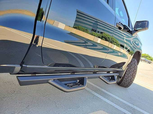 2019-2024 Dodge Ram 1500 crew cab with Ambush side steps showcasing sleek design and durability.