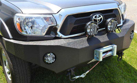 2012-2015 Toyota Tacoma front winch bumper with durable steel construction and powerful winch capacity.